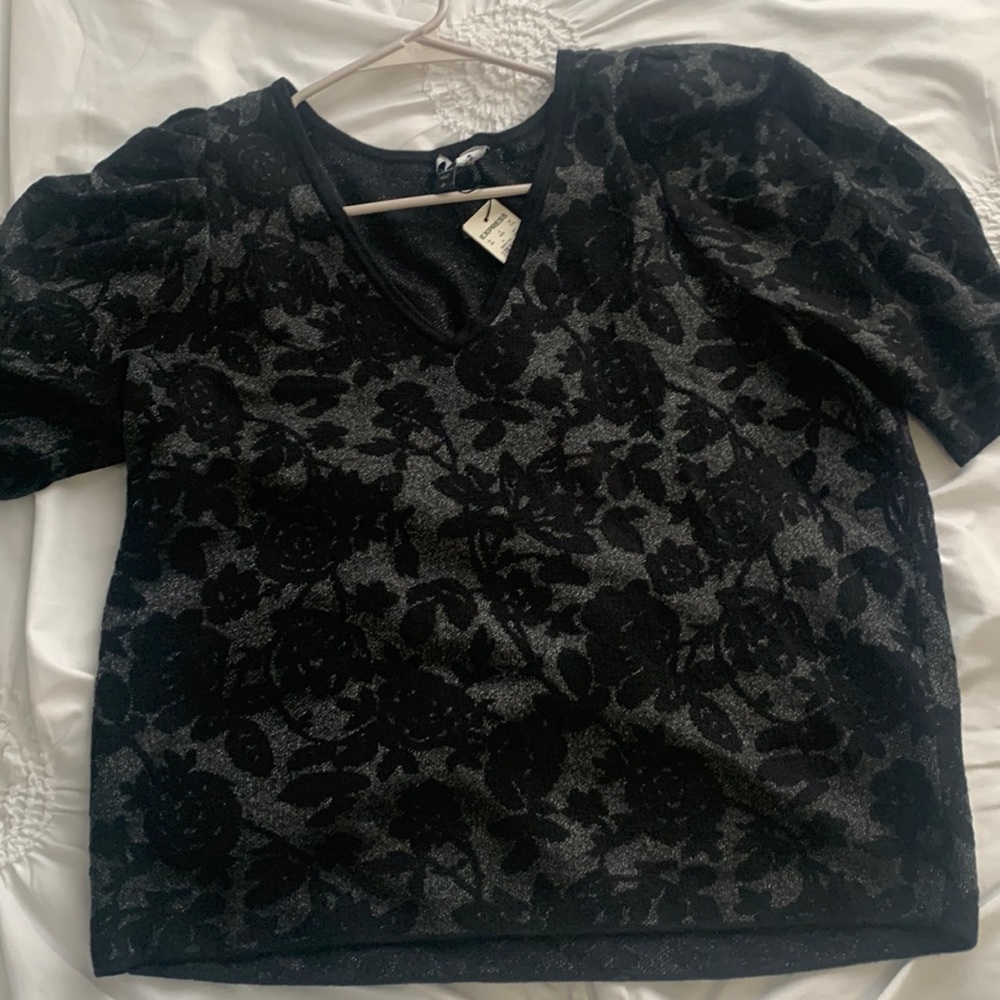 Brand: Express    Black with floral silver detail.
